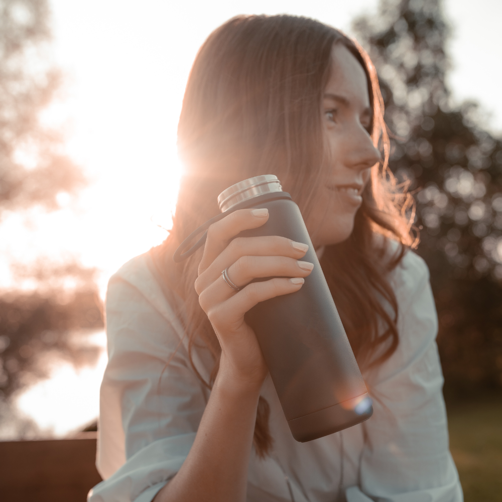 Woman drinking mBIOTA Elemental's superior tasting shake